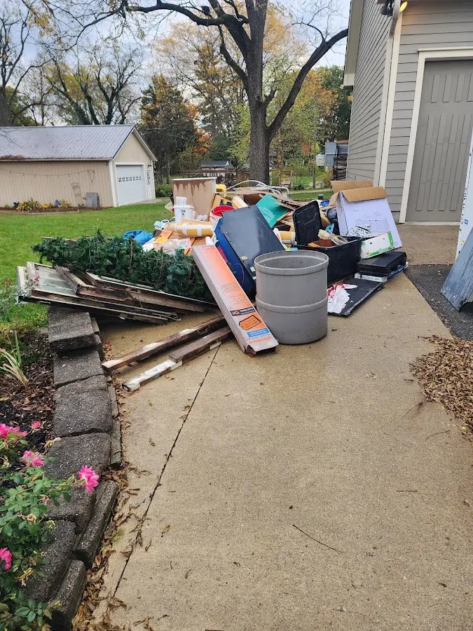 Dumpster being loaded with debris for Roofing Dumpster Rental in Calistoga